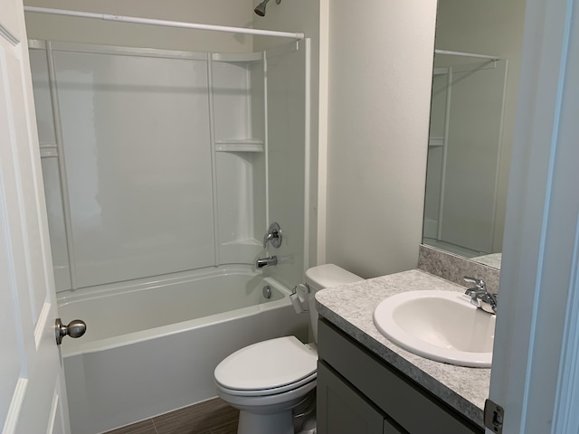 full bathroom with vanity,  shower combination, and toilet