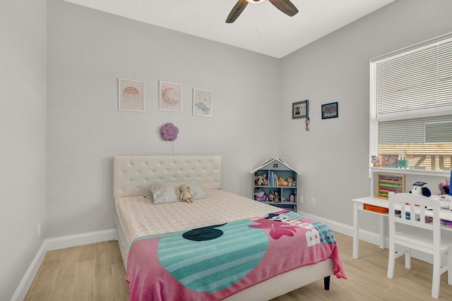 bedroom with hardwood / wood-style floors and ceiling fan