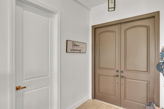 doorway with light hardwood / wood-style floors