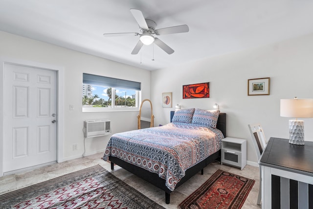 bedroom with an AC wall unit and ceiling fan