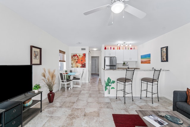 living room featuring ceiling fan