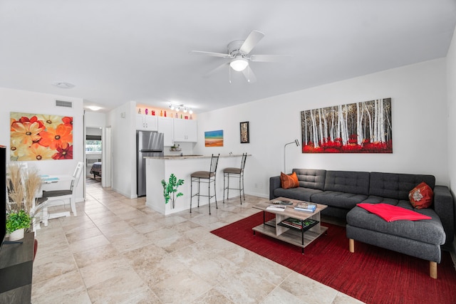 living room with ceiling fan