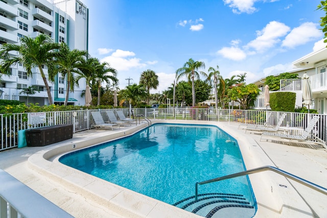 view of swimming pool with a patio