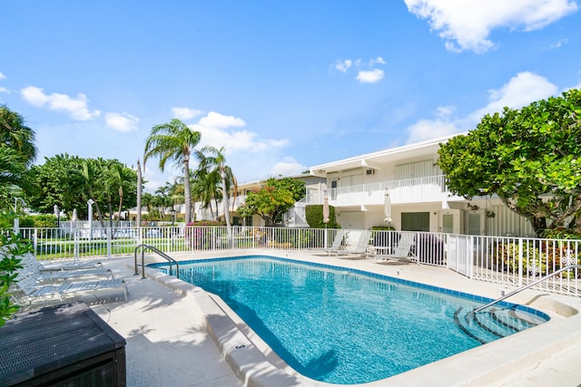 view of swimming pool featuring a patio area