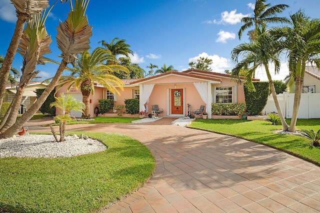 view of front of property with a front lawn