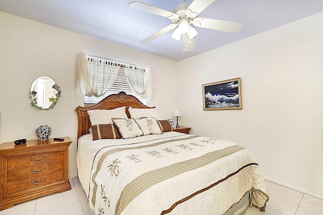 tiled bedroom with ceiling fan