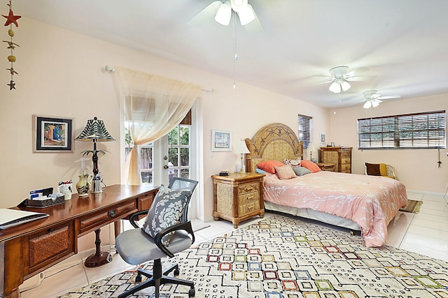 tiled bedroom with ceiling fan