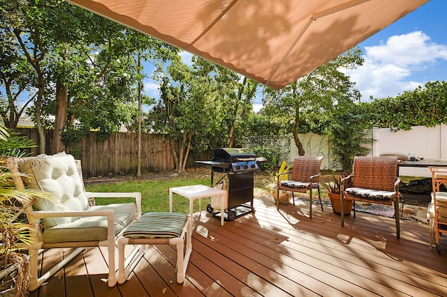 wooden terrace featuring area for grilling