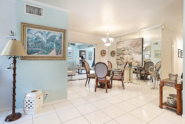 dining area with light tile patterned floors, ceiling fan, and crown molding