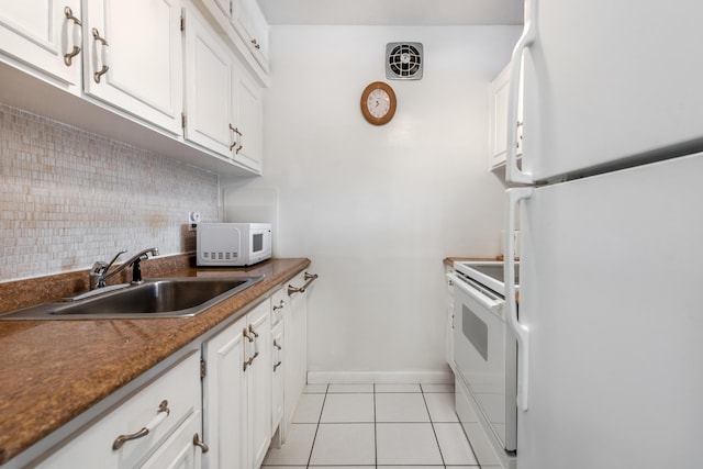 kitchen with sink, white cabinets, and white appliances