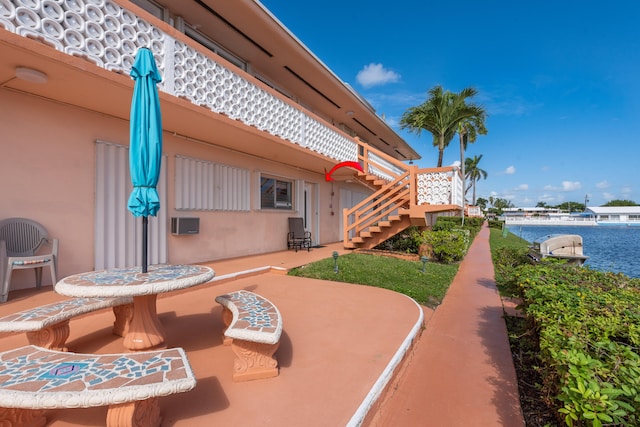 view of patio with a water view