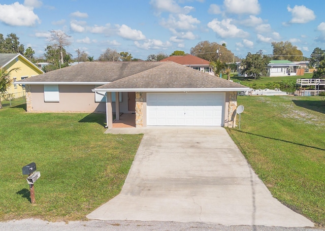 ranch-style home with driveway, stone siding, a garage, and a front yard