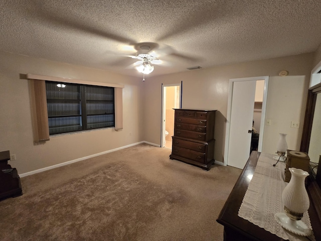 unfurnished bedroom with carpet floors, visible vents, and baseboards