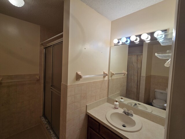 carpeted bedroom with ceiling fan and a textured ceiling