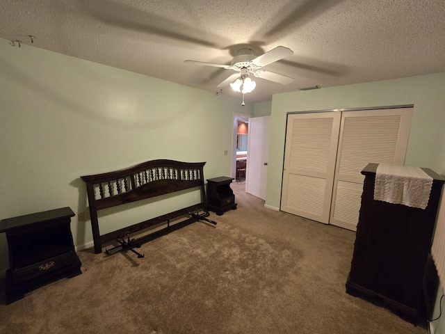 bedroom featuring a textured ceiling, a ceiling fan, baseboards, a closet, and carpet