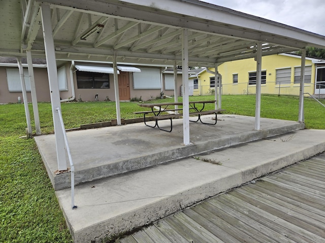 surrounding community featuring fence and a yard