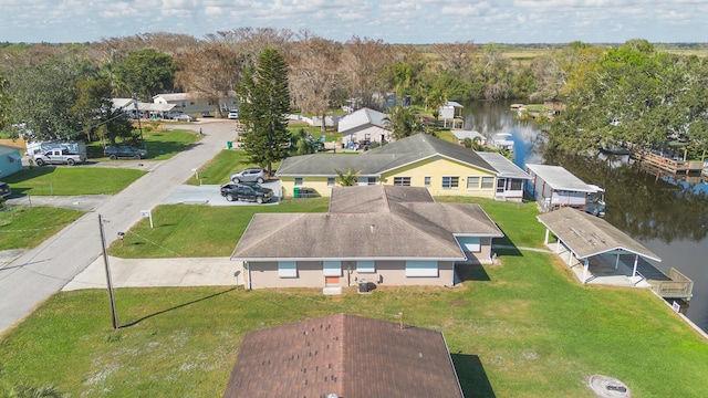 aerial view with a residential view and a water view