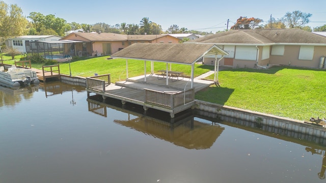 dock area featuring a residential view, a water view, a yard, and a gazebo