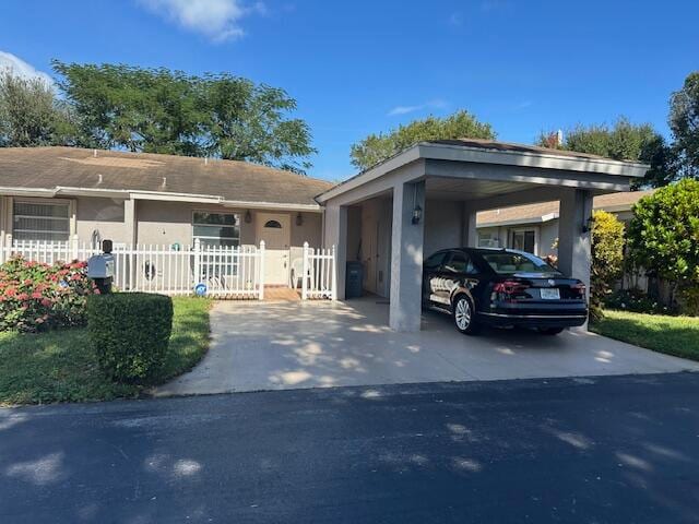 single story home with a carport