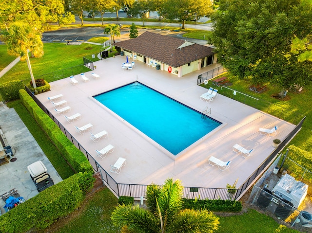 view of pool with a yard and a patio