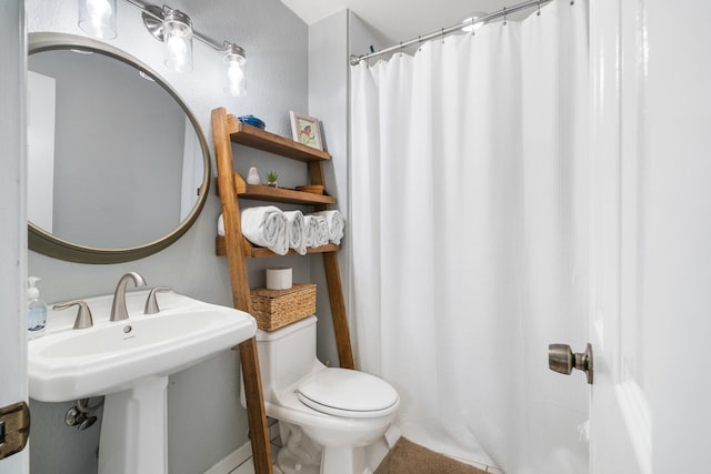 bathroom featuring toilet