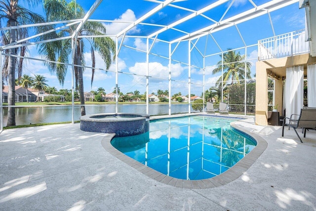 view of swimming pool featuring glass enclosure, a water view, an in ground hot tub, and a patio