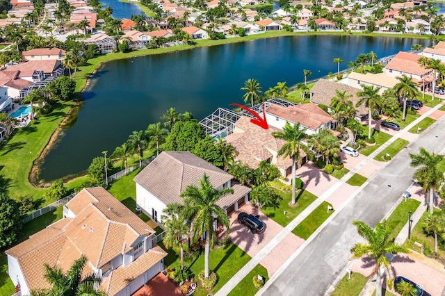 birds eye view of property with a water view