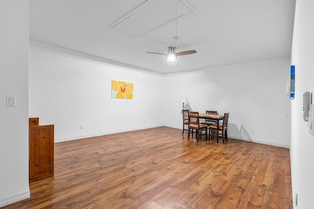 dining space featuring ceiling fan and wood-type flooring