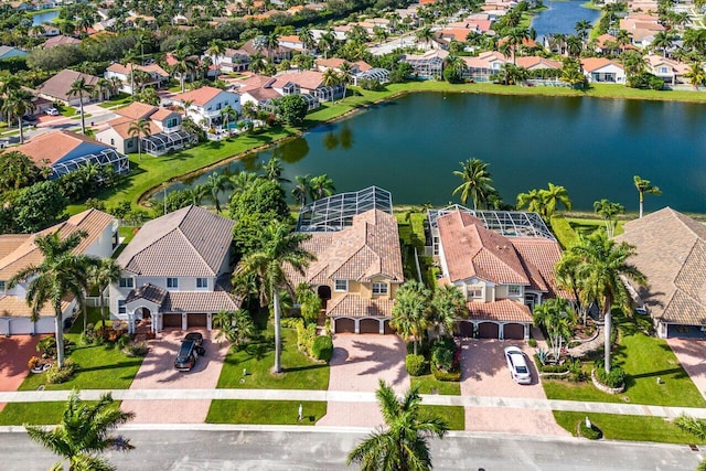 birds eye view of property featuring a water view and a residential view