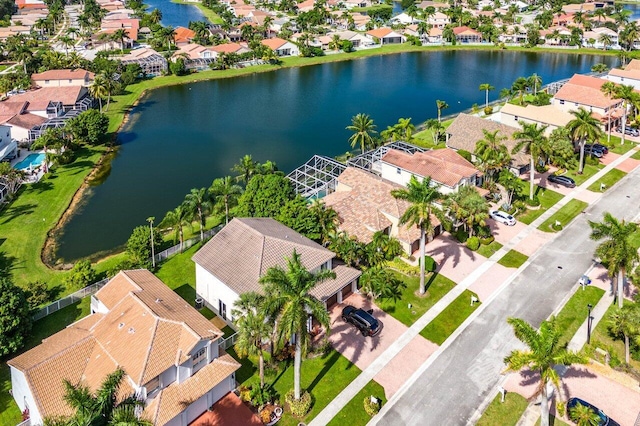 aerial view with a residential view and a water view