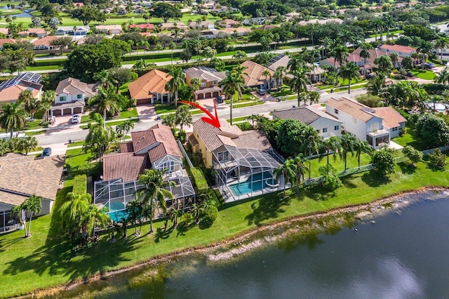 bird's eye view with a water view and a residential view