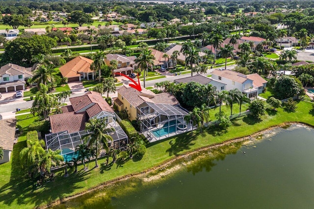 bird's eye view with a water view and a residential view