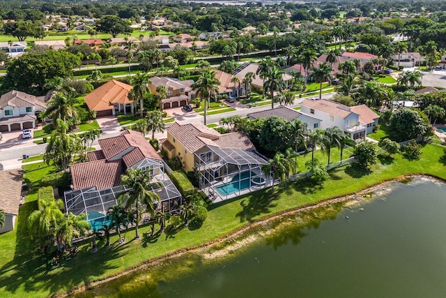 birds eye view of property featuring a residential view and a water view