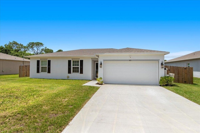 ranch-style home with a garage and a front lawn