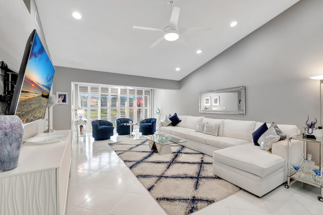 living room featuring light tile patterned floors, high vaulted ceiling, and ceiling fan