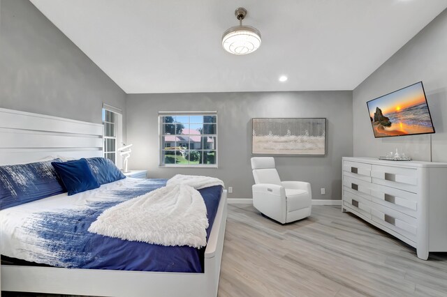 tiled living room with ceiling fan and high vaulted ceiling