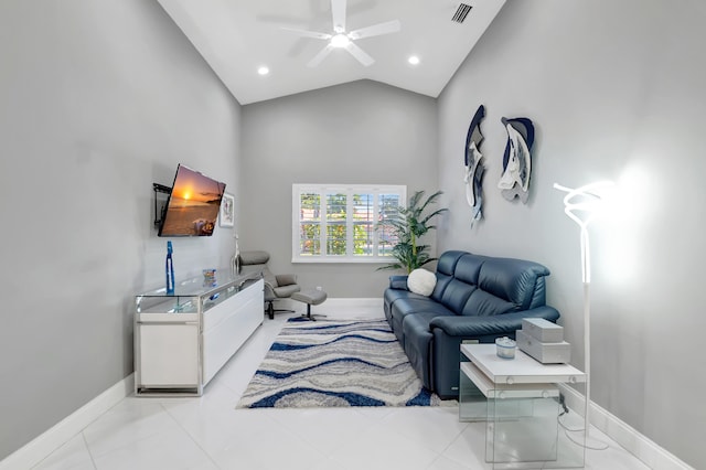 living room with ceiling fan and high vaulted ceiling