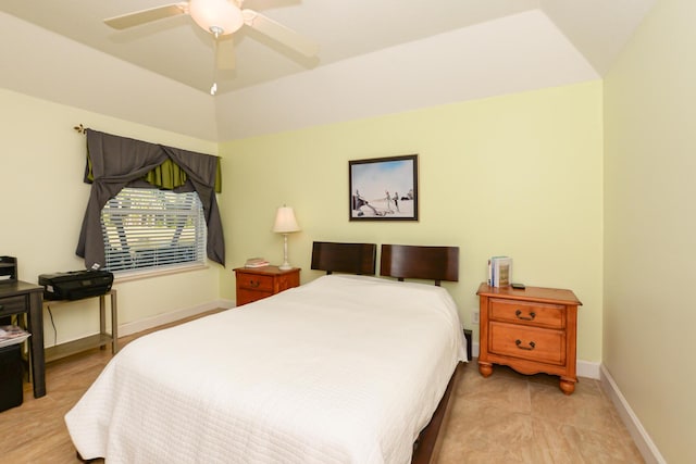 bedroom featuring ceiling fan and vaulted ceiling