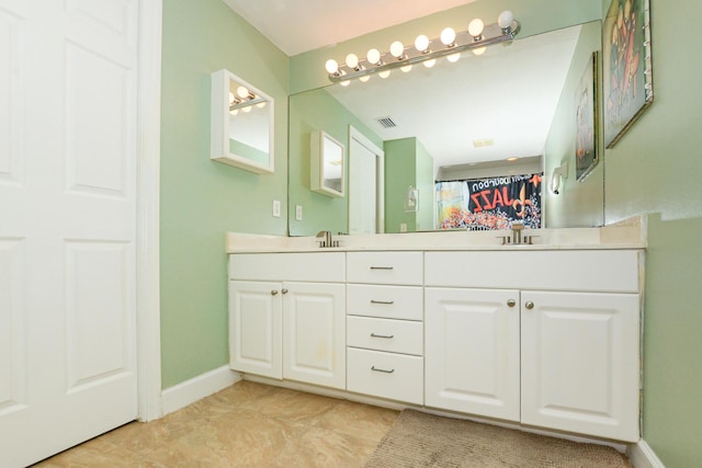 bathroom with vanity and tile patterned floors