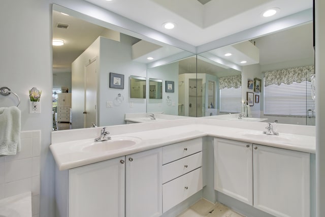 bathroom with tile patterned floors and vanity