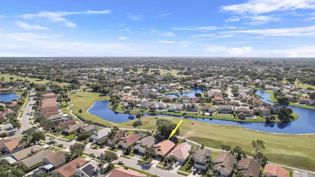 drone / aerial view with a water view