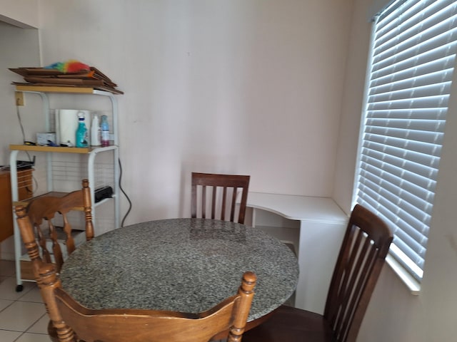 dining area with tile patterned flooring