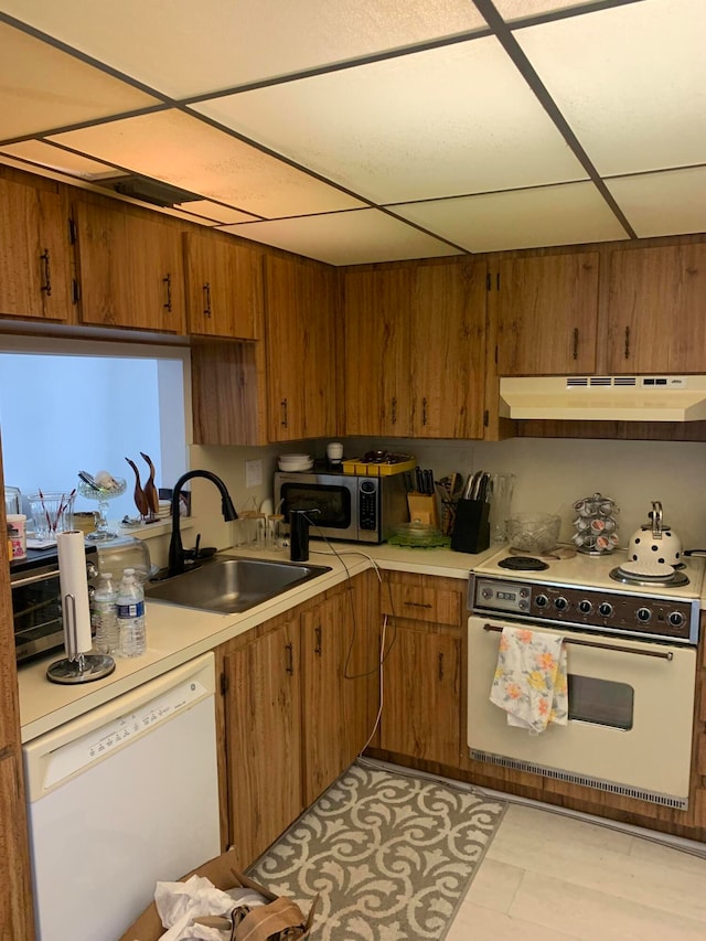 kitchen with white appliances and sink