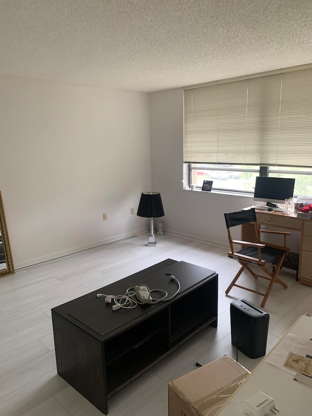 living room with a textured ceiling