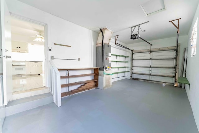 garage with ceiling fan and a garage door opener