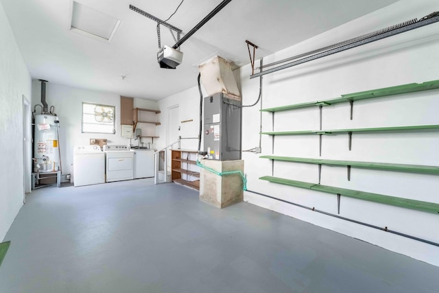 garage featuring washing machine and dryer, heating unit, a garage door opener, and water heater