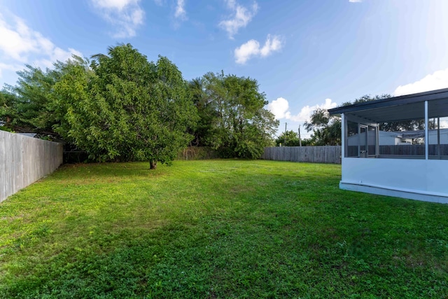 view of yard featuring a sunroom