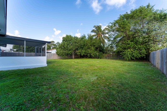 view of yard with a sunroom