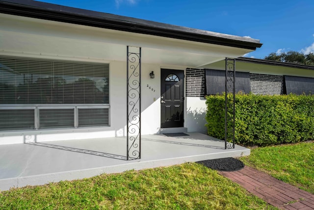 property entrance with covered porch