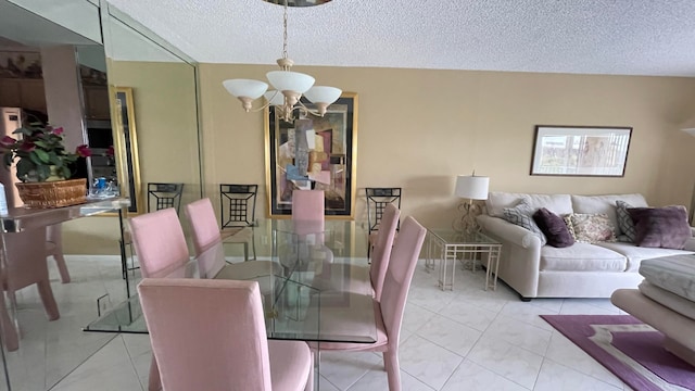 dining space featuring a textured ceiling and an inviting chandelier